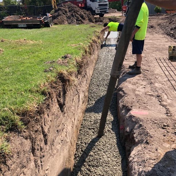 Newly excavated path just poured with concrete